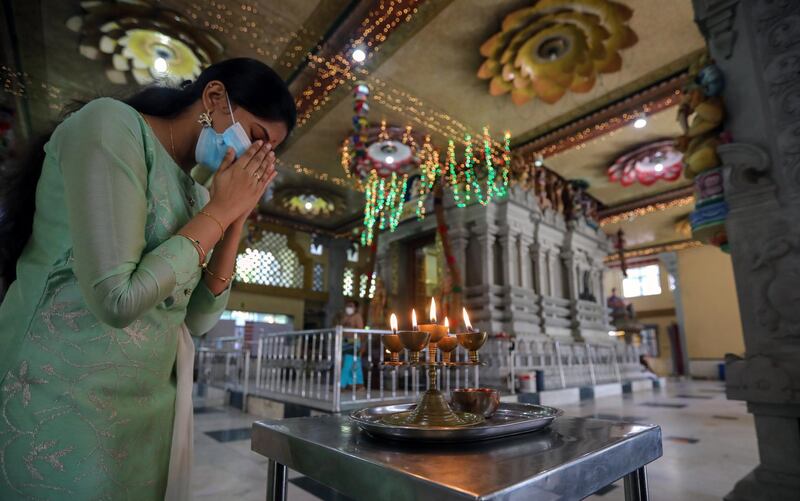 A Sri Lankan Hindu devotee prays during the Diwali Hindu festival amid the coronavirus pandemic at a Hindu temple in Colombo, Sri Lanka. EPA