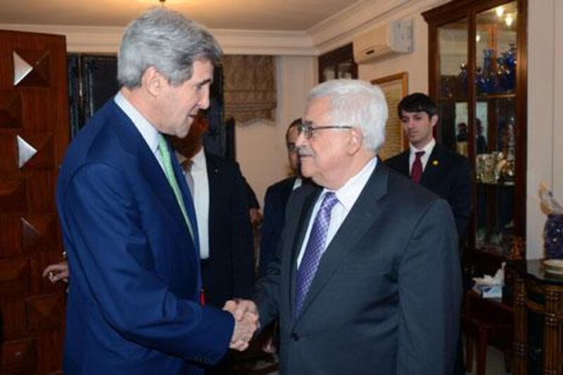 The Palestinian president, Mahmoud Abbas, right, meets the US secretary of state John Kerry on Saturday in Amman. Thaer Ghanaim / GPO via Getty Images