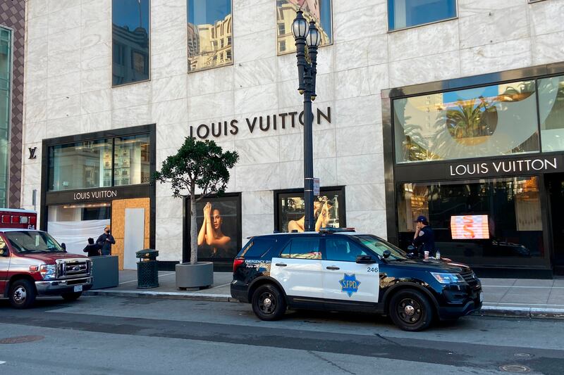 Police respond to a report of theft at the Louis Vuitton store in San Francisco's Union Square. AP