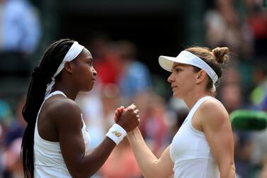 Simona Halep, right, shakes hands with Cori Gauff after defeating the American teenager in the fourth round at Wimbledon. PA Photo