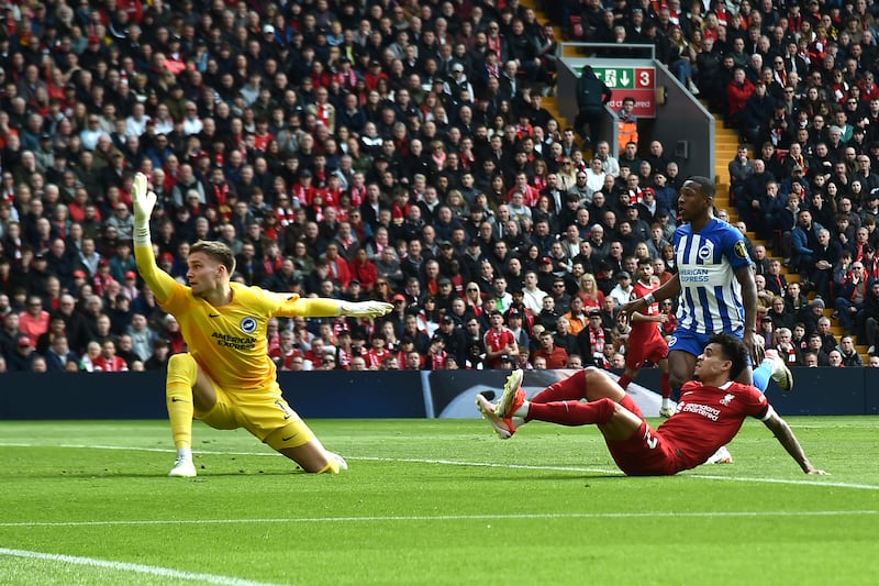 Liverpool's Luis Diaz beats Brighton goalkeeper Bart Verbruggen to score his side's first goal. AP 