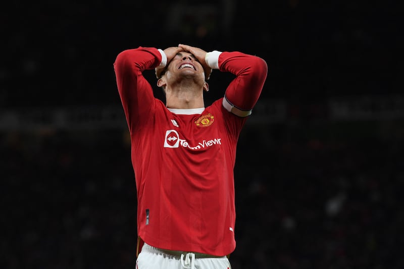 Manchester United's Portuguese striker Cristiano Ronaldo reacts to a missed chance during the English Premier League football match between Manchester United and Wolverhampton Wanderers at Old Trafford in Manchester, north west England, on January 3, 2022.  (Photo by Paul ELLIS / AFP) / RESTRICTED TO EDITORIAL USE.  No use with unauthorized audio, video, data, fixture lists, club/league logos or 'live' services.  Online in-match use limited to 120 images.  An additional 40 images may be used in extra time.  No video emulation.  Social media in-match use limited to 120 images.  An additional 40 images may be used in extra time.  No use in betting publications, games or single club/league/player publications.   /  
