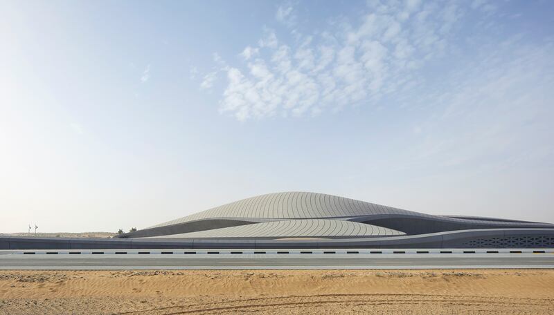 The new headquarters juts from the desert like a dune landscape