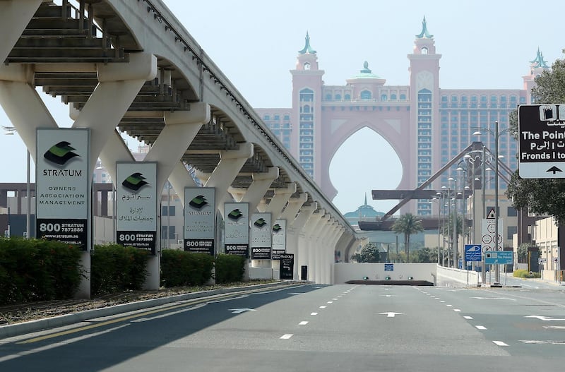 DUBAI, UNITED ARAB EMIRATES , April 17– 2020 :- View of the empty road going towards Atlantis hotel on Palm Jumeirah in Dubai. Dubai is conducting 24 hours sterilisation programme across all areas and communities in the Emirate and told residents to stay at home. UAE government told residents to wear face mask and gloves all the times outside the home whether they are showing symptoms of Covid-19 or not.  (Pawan Singh / The National) For News/Online/Instagram
