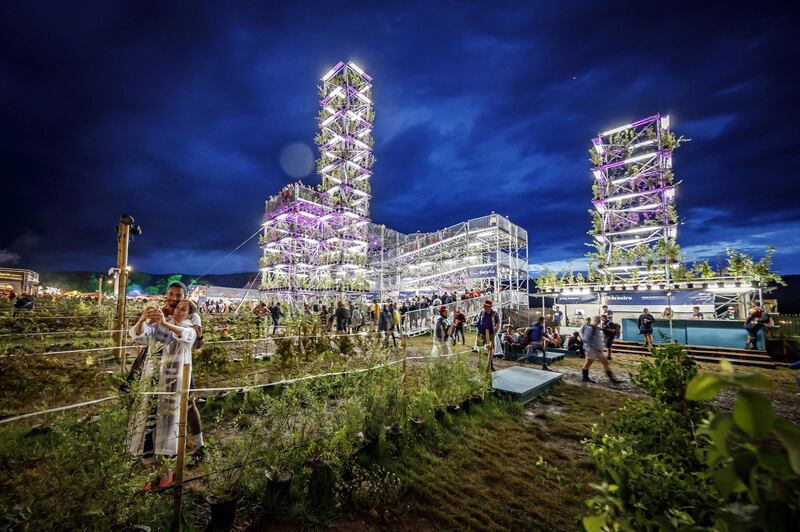 Festival goers walk by the UTOPIA2050 project installation by HES-SO school, during the 44th edition of the Paleo Festival, in Nyon, Switzerland.  The Paleo is an open-air music festival in the western part of Switzerland.  EPA