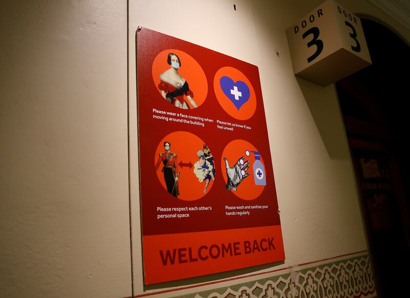 A welcome back sign requesting that people maintain precautions, is seen at the Royal Albert Hall in London, Britain, July 19, 2021