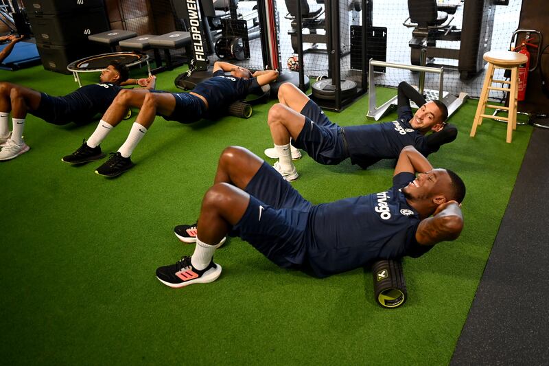 Callum Hudson-Odoi and Hakim Ziyech during a warm up in the gym before a training session at Chelsea training ground.