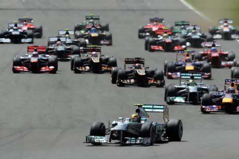 Lewis Hamilton leads into the first corner at the British Grand Prix. But it was his teammate Nico Rosberg who would go on to win the race.