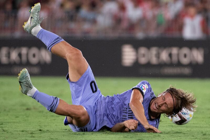 Real Madrid's Croatian midfielder Luka Modric falls down following a challenge by an Almeria player. AFP