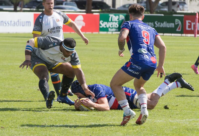 Dubai, United Arab Emirates -Rugby game between Jebel Ali Dragons (Blue shirt) and Dubai Hurricane (Gray shirt) at The Sevens Stadium.  Ruel Pableo for The National