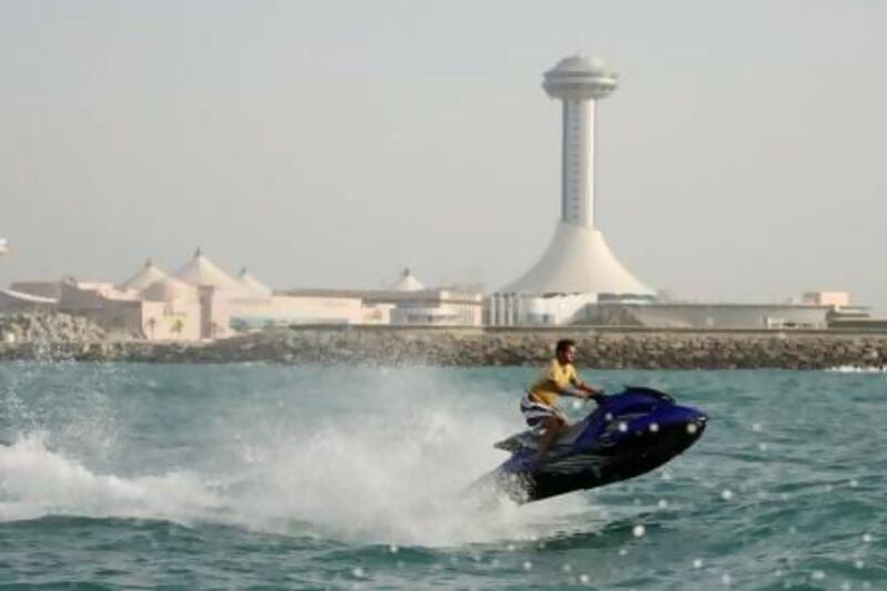 The Abu Dhabi Tourism and Cultural Authority (TCA) is working on new rules to address concerns of hoteliers that jet skis could endanger their guests. Andrew Parsons / The National