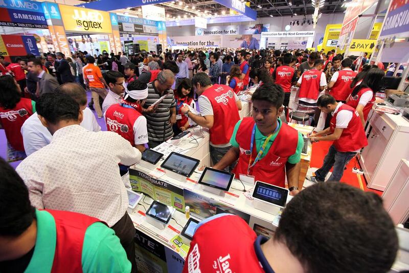 Visitors on the first day of GITEX Shopper 2013 held at Dubai World Trade Centre in Dubai. Pawan Singh / The National 