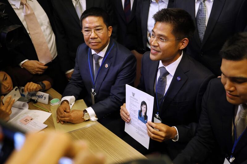 An official of Raksa Chart party holds the registration document bearing the photograph of Thai Princess Ubolratana prior to submitting to election commission officials in Bangkok. AFP
