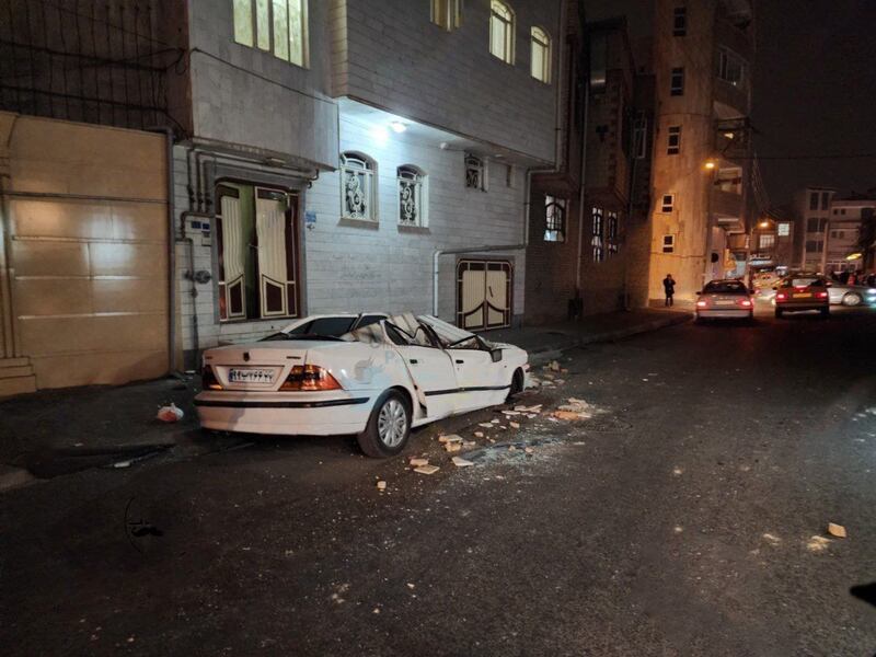 A car crushed by falling debris in the north-western Iranian city of Khoy, which was hit by a 5.9 magnitude earthquake on January 28. EPA