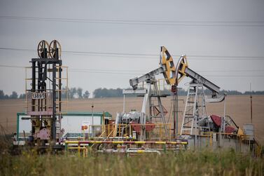 Oil pumping jacks, also known as "nodding donkeys", operate in an oilfield near Almetyevsk, Russia. Refiners’ margins are expected to revive in 2021 but will remain below mid-cycle levels, Moody’s said. Bloomberg