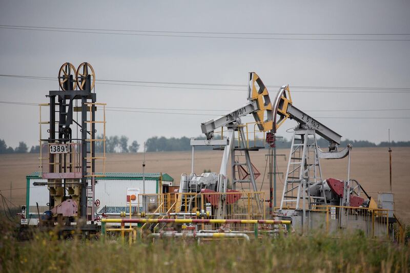 Oil pumping jacks, also known as "nodding donkeys", operate in an oilfield near Almetyevsk, Russia, on Sunday, Aug. 16, 2020. Oil fell below $42 a barrel in New York at the start of a week that will see OPEC+ gather to assess its supply deal as countries struggle to contain the virus that’s hurt economies and fuel demand globally. Photographer: Andrey Rudakov/Bloomberg