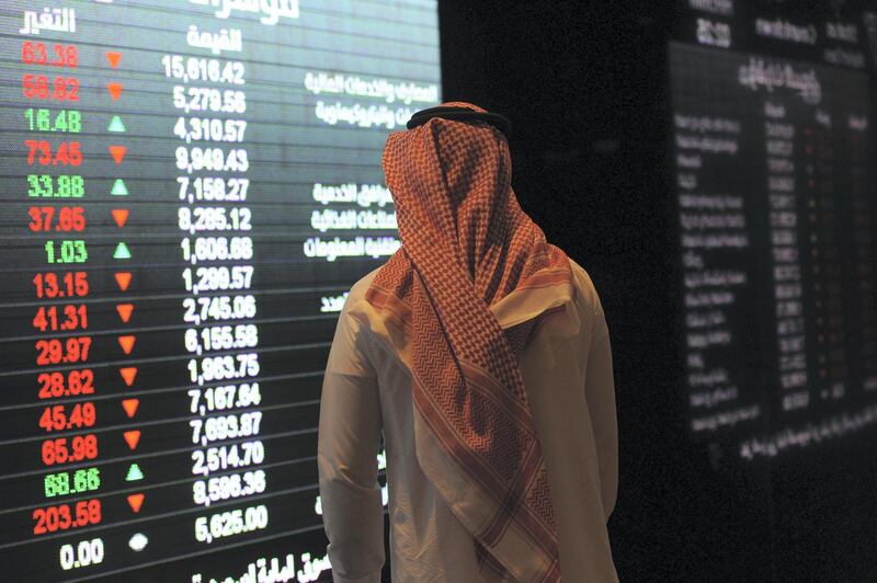 A Saudi investor monitors the stock exchange at the Saudi Stock Exchange, or Tadawul, on December 14, 2016  in the capital Riyadh. / AFP PHOTO / FAYEZ NURELDINE