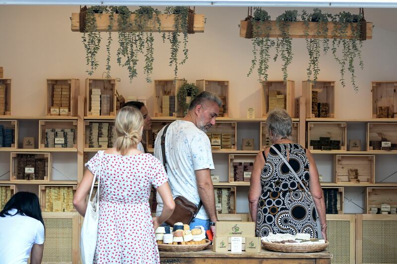 Visitors shopping at Unwrapped, an artisanal soap and body products stall at Ripe Market Al Maryah Island. All photos: Khushnum Bhandari / The National
