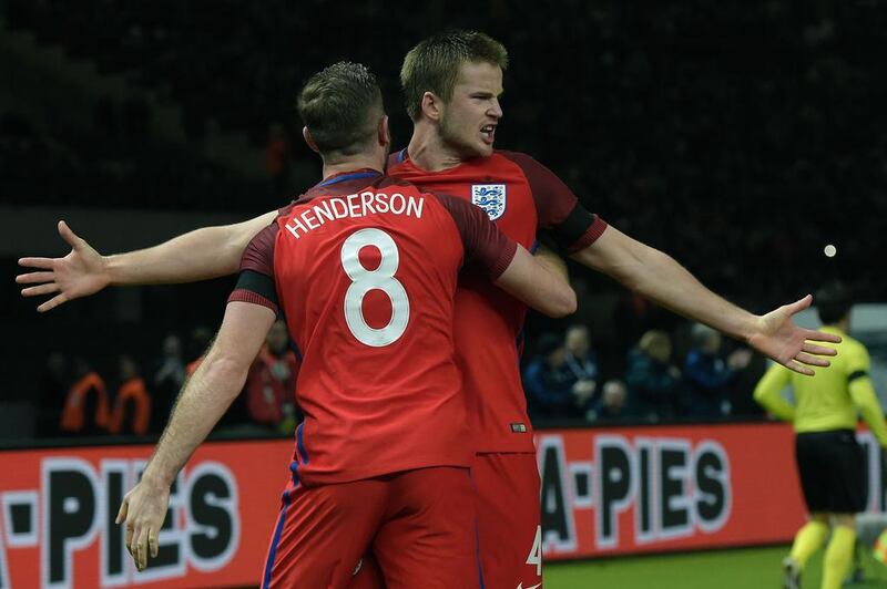 England’s midfielder Eric Dier celebrates scoring the winning goal with his team-mate England’s midfielder Jordan Henderson (front) during the friendly football match Germany v England at the Olympic Stadium in Berlin on March 26, 2016. England won the match 2-3. / AFP / TOBIAS SCHWARZ