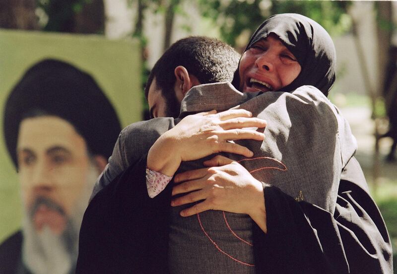 An Iranian mother hugs her son in Tehran following his release from an Iraqi prison, on August 1, 1989. AFP