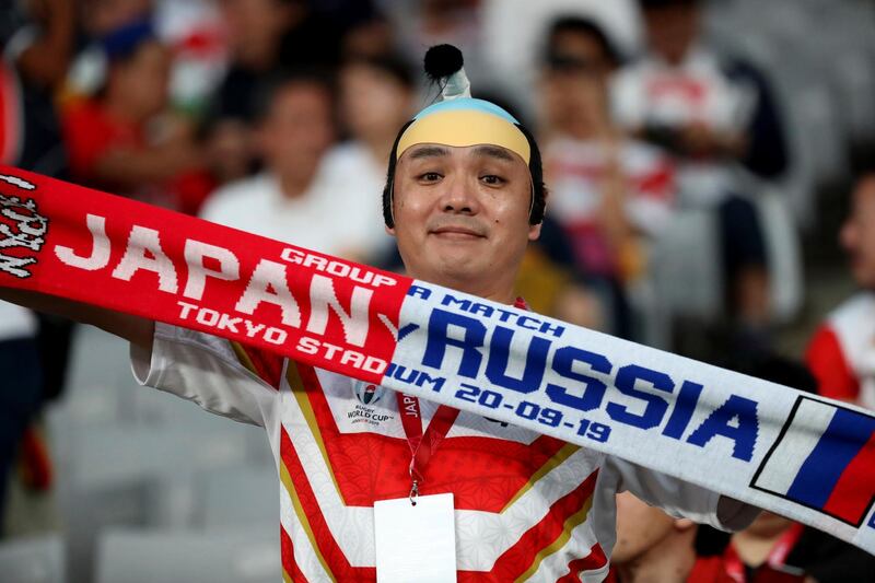 A supporter of Japan team waits for the Rugby World Cup Pool A game at Tokyo Stadium between Russia and Japan in Tokyo, Japan. AP Photo