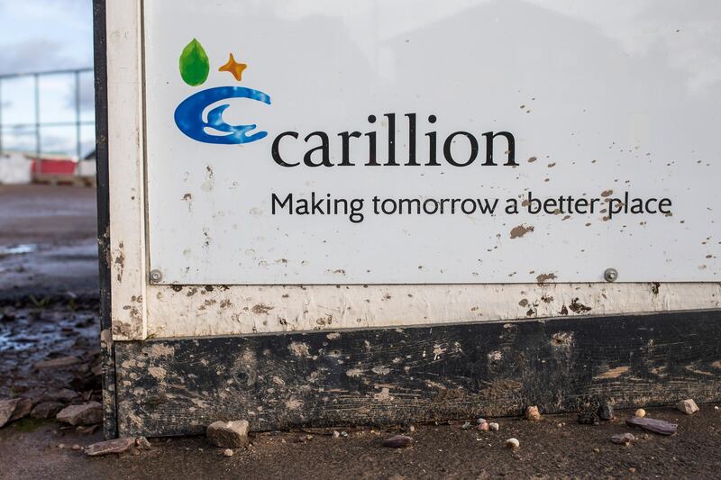 The Carillion Plc logo sits on hoarding surrounding the Midland Metropolitan Hospital construction site, operated by Carillion, in Smethwick, U.K., on Thursday, Jan. 18, 2018. The Wolverhampton, central England-based company filed for liquidation on Monday after failing in last-ditch efforts to get support from lenders and the government. Photographer: James Beck/Bloomberg