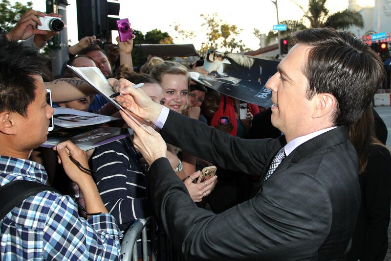 Ed Helms signs autographs at the LA Premiere of "The Hangover: Part III" at the Westwood Village Theatre on Monday, May 20, 2013 in Los Angeles. (Photo by Matt Sayles/Invision/AP) *** Local Caption ***  LA Premiere of The Hangover Part III.JPEG-001f3.jpg