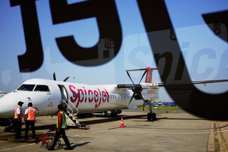 A Bombardier Q400 turboprop airliner belonging to the Indian airline SpiceJet. Rival propeller plane maker ATR claims Bombardier has received unfair state funding. Roberto Schmidt / AFP 