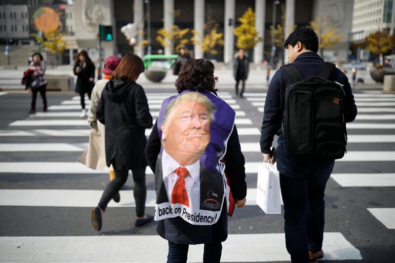 A protester from a conservative civic group walks on a zebra crossing in central Seoul, South Korea. Kim Hong-ji / Reuters