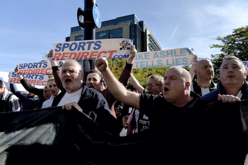 NEWCASTLE UPON TYNE, ENGLAND - SEPTEMBER 29:  Newcastle United fans protest against chairman Mike Ashley prior to the Premier League match between Newcastle United and Leicester City at St. James Park on September 29, 2018 in Newcastle upon Tyne, United Kingdom.  (Photo by Mark Runnacles/Getty Images)