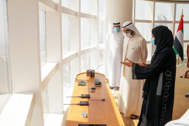 Sheikh Mohammed bin Rashid speaks to members of the team launching the Ghalib satellite