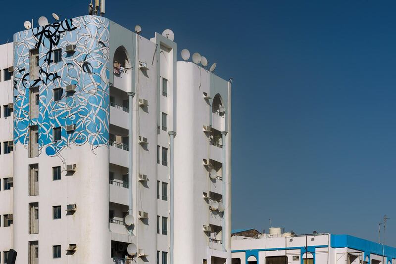 El Seed's Ajman mural joins major works by the artist in Paris, New York, Melbourne and Cairo. Courtesy: Christindim