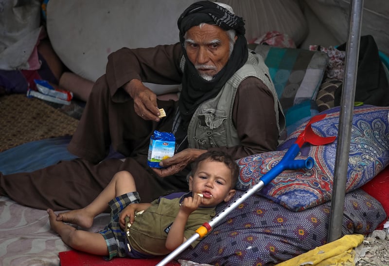 Internally displaced families from northern provinces take shelter in a public park in Kabul.