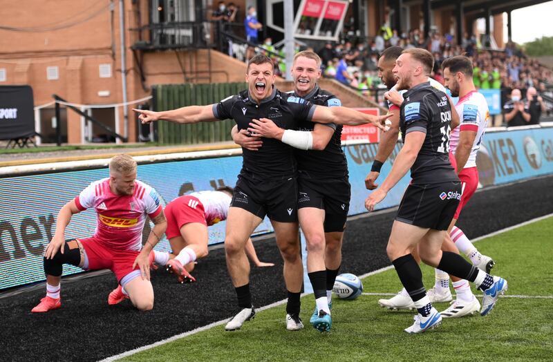 Falcons wing Adam Radwan celebrates with teammates after scoring a try against Harlequins at Kingston Park. Getty Images