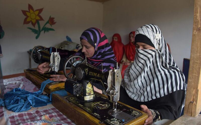 Pakistani Kashmiri girls stitch cloth during their class at the women's market on the outskirts of Rawalakot in Pakistani-administered Kashmir. Sajjad Qayyum/AFP



