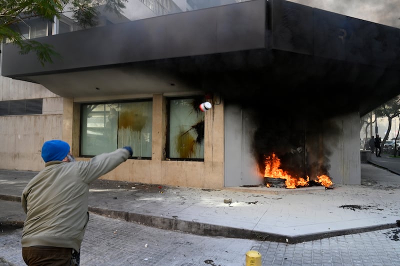 A FransaBank branch in the Badaro neighbourhood was also set on fire during the protest. EPA