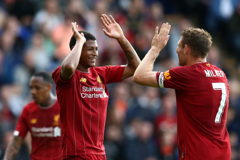 BIRKENHEAD, ENGLAND - JULY 11: Rhian Brewster of Liverpool celebrates his goal with James Milner of Liverpool during the Pre-Season Friendly match between Tranmere Rovers and Liverpool at Prenton Park on July 11, 2019 in Birkenhead, England. (Photo by Jan Kruger/Getty Images)