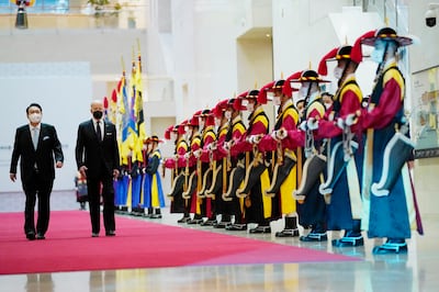 US President Joe Biden attends a state dinner hosted by South Korean President Yoon Suk-yeol, left, at the National Museum of Korea on Saturday. AP Photo