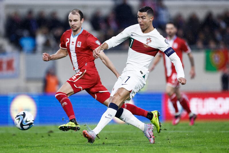 Portugal's Cristiano Ronaldo shoots and scores his team's fourth goal. AFP