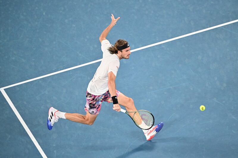 Stefanos Tsitsipas hits a return against Novak Djokovic. AFP