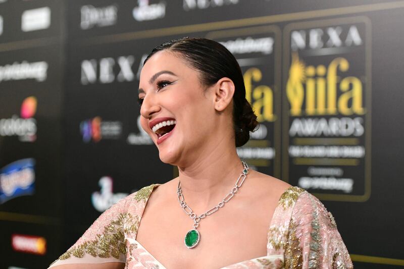 Actress Gauahar Khan walks the green carpet. 