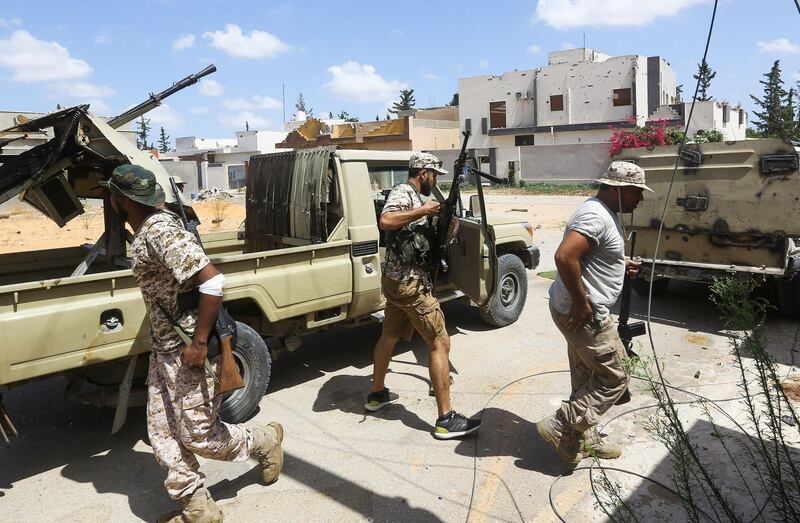 Fighters loyal to the internationally recognised Libyan Government of National Accord (GNA) gather during clashes with forces loyal to strongman Khalifa Haftar in the capital Tripoli's suburb of Ain Zara.  AFP