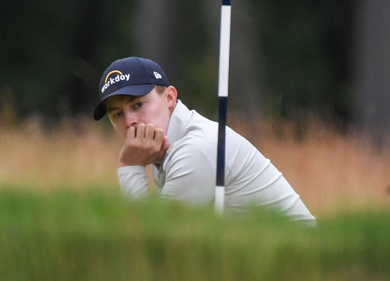 Matt Fitzpatrick of England reacts to a missed putt on the ninth green. EPA
