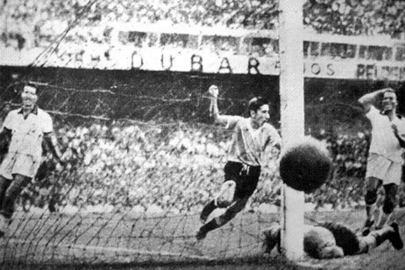 Uruguay’s Alcides Ghiggia, centre, scores the match-winner to silence Brazil in the World Cup final at Maracana Stadium in Rio de Janeiro on July 16, 1950.