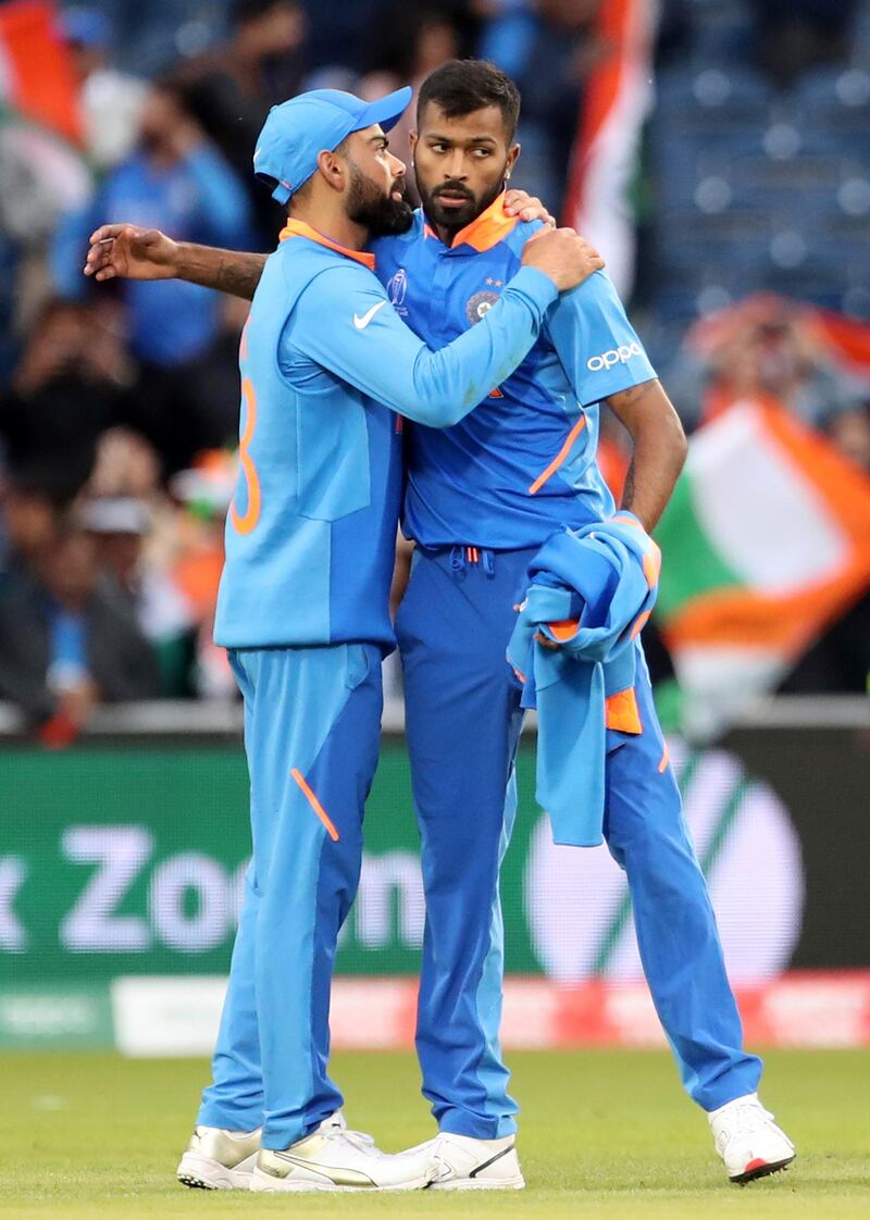 India's captain Virat Kohli, left, hugs teammate Hardik Pandya after their win in the Cricket World Cup match against Pakistan at Old Trafford in Manchester, England, Sunday, June 16, 2019. (AP Photo/Aijaz Rahi)