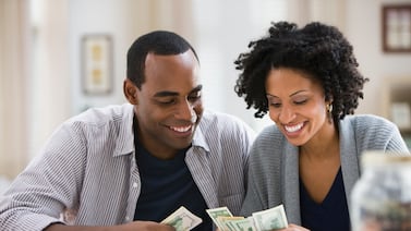 Getting on the same page as your partner when it comes to finances usually requires a lot of communication and sometimes a little compromise. Getty Images