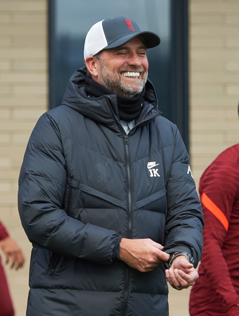 Manager Jurgen Klopp of Liverpool smiles during a training session at AXA Training Centre in Kirkby, England.