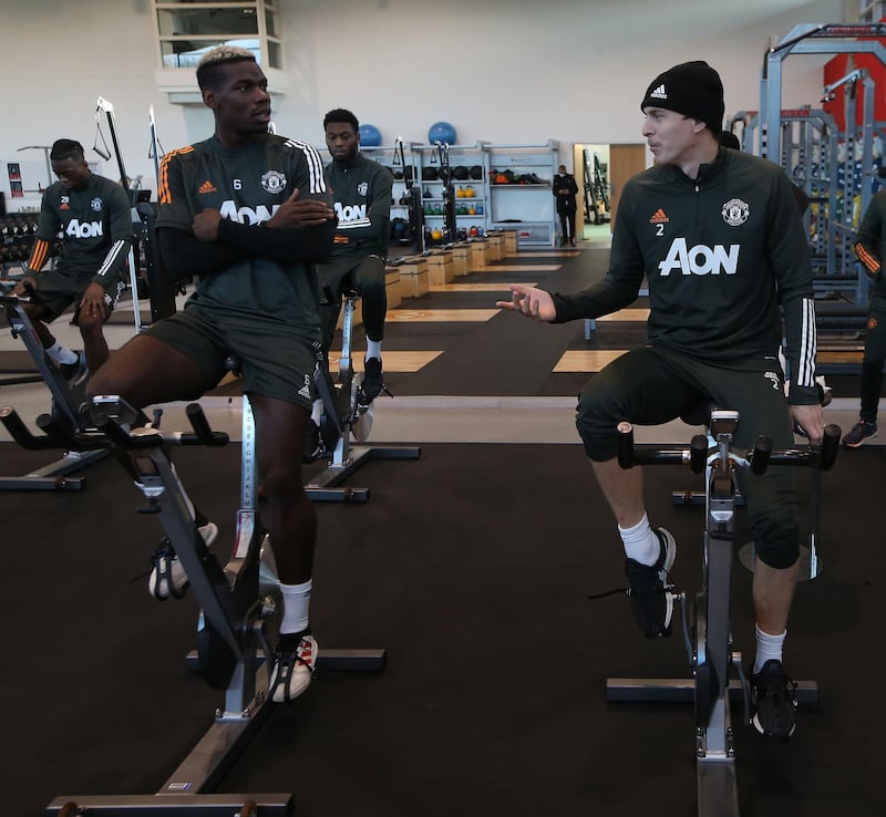 MANCHESTER, ENGLAND - NOVEMBER 19: (EXCLUSIVE COVERAGE) Paul Pogba and Victor Lindelof of Manchester United in action during a first team training session at Aon Training Complex on November 19, 2020 in Manchester, England. (Photo by Matthew Peters/Manchester United via Getty Images)