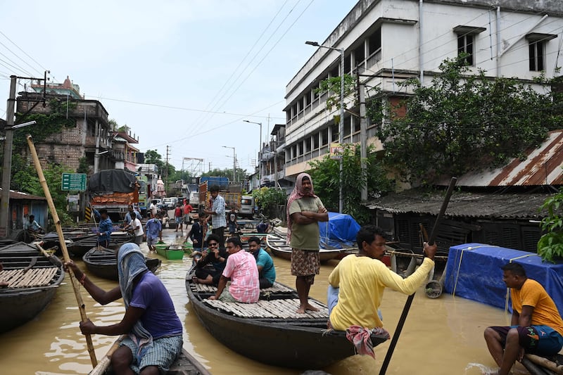 Residents swap cars for boats in Ghatal, Paschim Medinipur district, India.