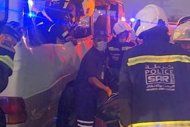 Police and ambulance workers at the scene of the crash on Emirates Road in Dubai on Saturday. Courtesy: Dubai Police